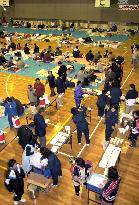 Mt. Usu evacuees queue for meals